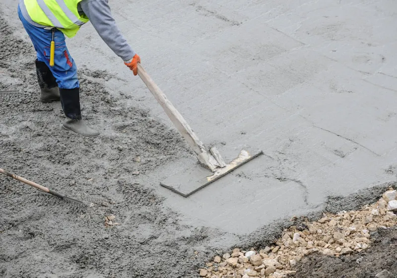 Tiffin Concrete Co. contractor finishing a fresh concrete pour